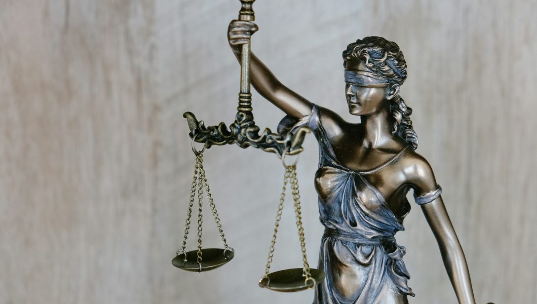 Lady Justice holding up her scales