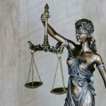 Lady Justice holding up her scales