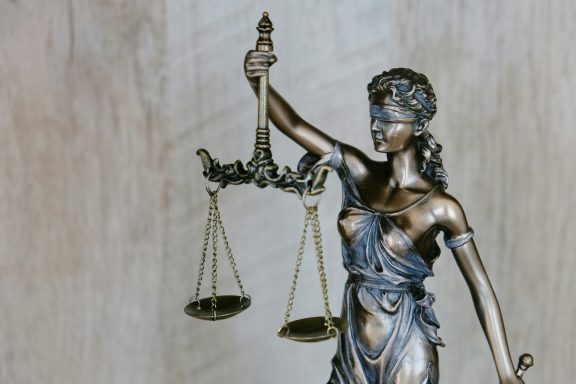 Lady Justice holding up her scales